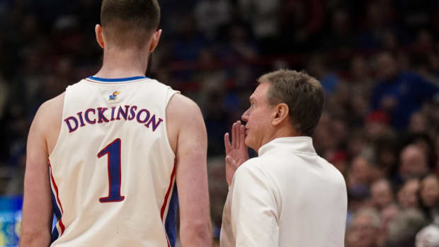 Jan 22, 2024; Lawrence, Kansas, USA; Kansas Jayhawks center Hunter Dickinson (1) talks with head coach Bill Self against the Cincinnati Bearcats during the first half at Allen Fieldhouse.